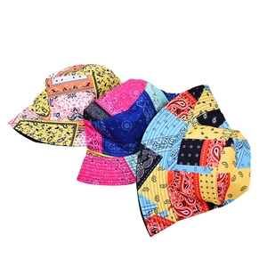Three vibrant paisley pattern bucket hats in yellow, pink and blue patchwork canvas