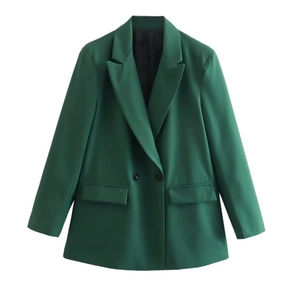 Detail shot of a dark green double-breasted blazer with notched lapels and flap pockets