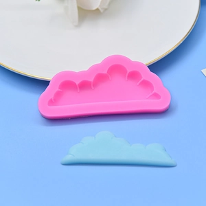 Cloud-shaped silicone fondant mold with a blue finished sample for DIY cake baking