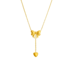 Golden stainless steel necklace featuring bow tie design with a heart tassel pendant