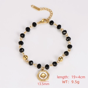 Macro detail of golden beaded bracelet with heart pendant and 19+4cm length info