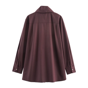 Back view of a loose dark chestnut long-sleeved shirt with a pleated design for women