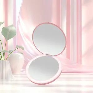 Pink portable LED folding makeup mirror with circular dual-sided ring light design