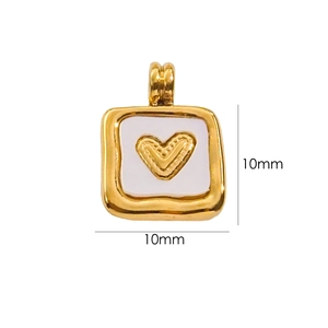 Detail of a 10mm square gold-plated pendant with white enamel and heart engraving