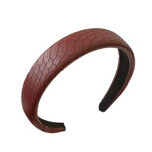 Brown faux snakeskin wide headband with textured pattern and minimalist retro style