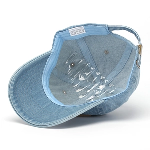 Detailed view of 100% cotton washed denim baseball cap lining with metal buckle