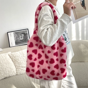 Plush heart tote bag styled with a minimalist outfit in a modern home setting
