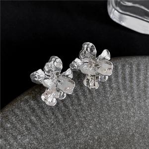 Artistic silver liquid metal floral earrings with irregular pleated flower petal texture