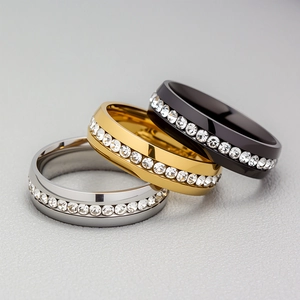 Polished stainless steel rings in silver, gold, and black with full-circle zircon inlay