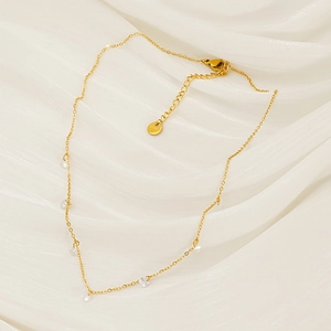 Vintage 18k gold plated titanium steel necklace with zircon crystals on white silk