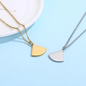 Polished fan-shaped pendant necklaces in gold and silver stainless steel finish