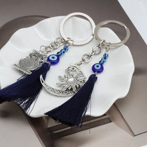 Ethnic owl and moon sun keychain with blue evil eye beads and silk tassels