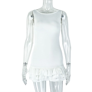 Close-up of white sleeveless dress featuring a stylish double-layered ruffled hem design