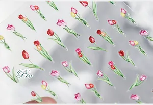 Detail shot of tulip nail stickers featuring vibrant red and pink floral patterns on transparent film