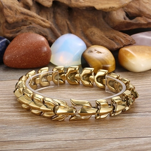 Detailed view of dragon-style U-shaped chain links on a gold titanium steel bracelet