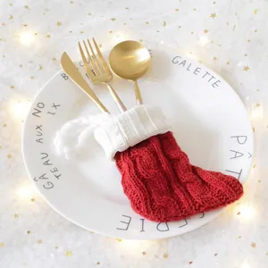 Red and white knit Christmas stocking cutlery holder with festive cable pattern