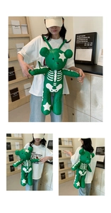 Three-way view of green bear-shaped backpack with skull patterns on a model