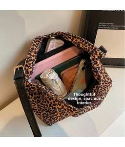 Internal view of leopard print canvas bag showing large capacity for daily essentials