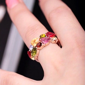 Rose gold ring featuring multi-color pear-cut zircons and elegant prong-set colorful stones
