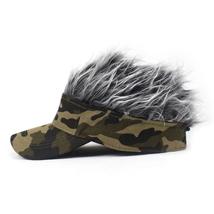 Detail of camouflage visor with messy grey and white synthetic hair extensions