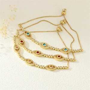 Detailed shot of evil eye bracelets in gold with colorful zircon and adjustable clasp