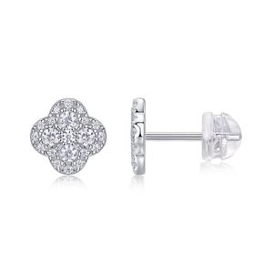 Macro detail of silver four-leaf clover earrings with sparkling clear zircon stones