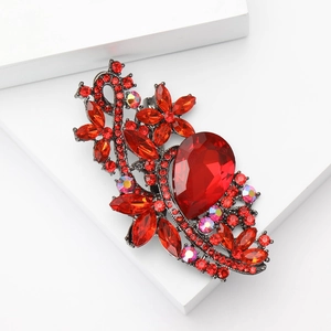 Vintage red crystal flower brooch with black metal base on white display stand