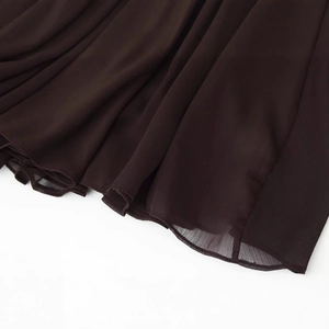 Dark brown sheer pleated chiffon dress hem featuring fine double-layer ruffled details