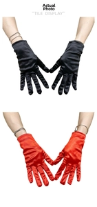 Detail view of glossy satin bridal gloves in black and red colors for formal events
