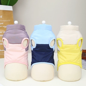 Winter padded pet vests in pink, blue, and yellow colorblock nylon for dogs and cats