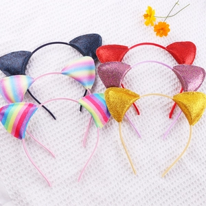 Detail of six glittery cat ear headbands in black, purple, gold, and rainbow colors