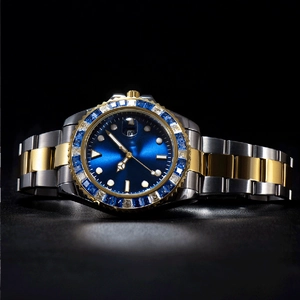 Detail of luxury men's watch with blue dial and sparkling gemstones on bi-color steel band
