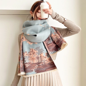 Detail of vintage landscape pattern and tassel edge on a thick cashmere scarf