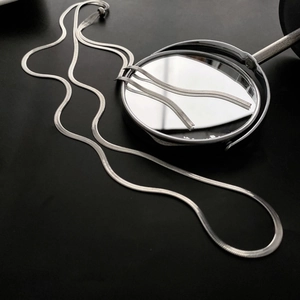 Minimalist silver snake chain long adjustable necklace shown with mirror reflection