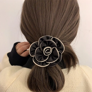 Elegant camellia hair scrunchie in black satin with white piping for French retro style
