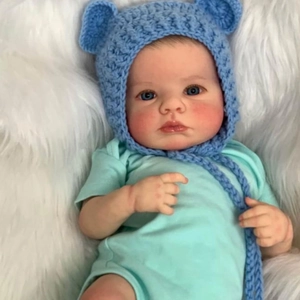 Lifelike 49cm reborn newborn baby doll wearing blue bear hat and mint green bodysuit
