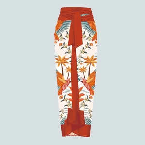 Detailed view of tropical parrot print sarong wrap skirt with vibrant red waist tie belt