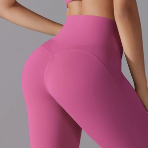 Macro shot of rose pink high-waisted yoga pants with heart-shaped butt lifting seams