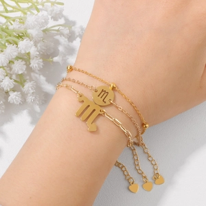 Three-piece layered gold Scorpio zodiac bracelet set for women with minimalist charms