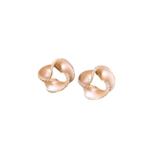 14K gold plated heart stud earrings with twisted texture and pavé crystals on white background