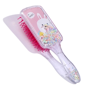 Detail of transparent hairbrush featuring a cute white rabbit and colorful foam beads