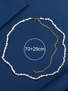 Detail of seashell body chain with 70+29cm length specification on a blue background