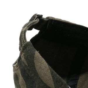 Detail of camouflage baseball cap showing adjustable metal buckle and stitching