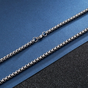 Polished silver stainless steel link necklace with secure lobster clasp on sleek background