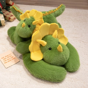 Cute green plush triceratops stuffed animals in two sizes on soft white carpet