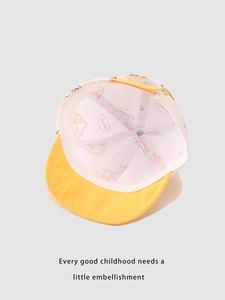 Breathable white mesh lining detail of kids cartoon dinosaur baseball cap in bright yellow