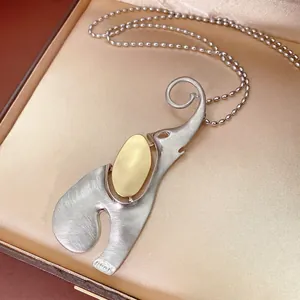 Brushed stainless steel abstract elephant pendant necklace with gold bead chain