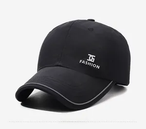 Detail of black quick-dry baseball cap featuring side fashion logo and reflective brim edge