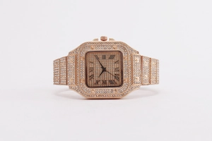 Close-up of rose gold square watch featuring a full iced-out rhinestone bezel and Roman numerals
