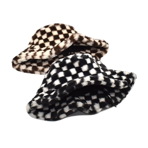 Detail of plush checkerboard bucket hat showing soft faux fur texture and adjustable drawstring